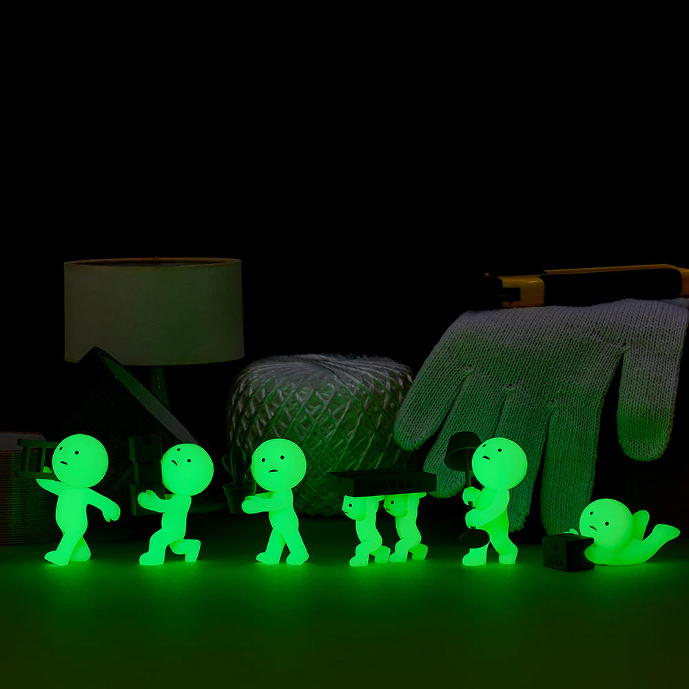 Smiski collectible figure, glow-in-the-dark mini character in quirky poses, perfect for shelves and desks.