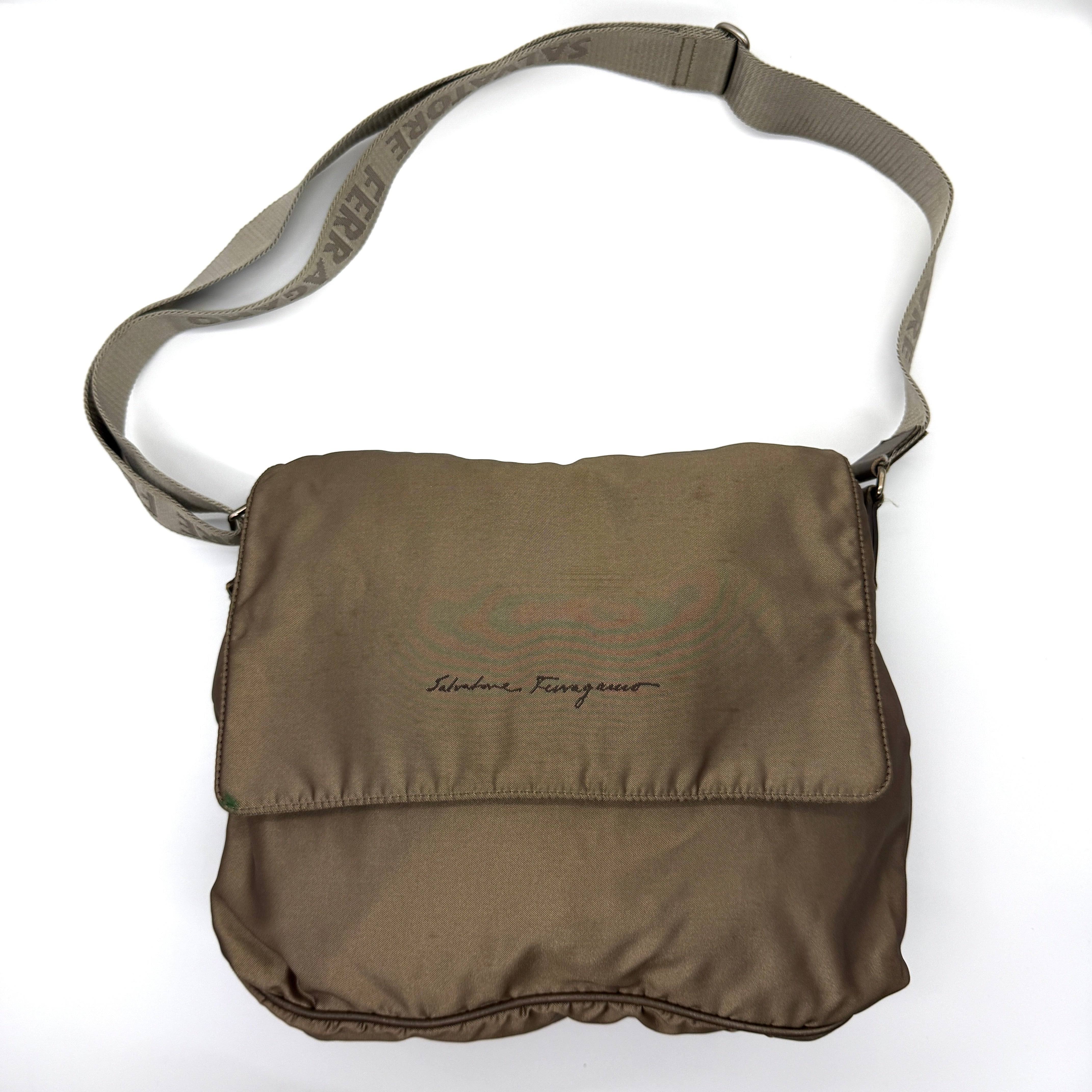 Brown Salvatore Ferragamo nylon messenger crossbody bag with branded strap and monogram interior.