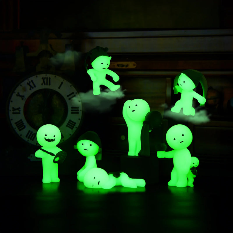 Smiski collectible figure, glow-in-the-dark mini character in quirky poses, perfect for shelves and desks.