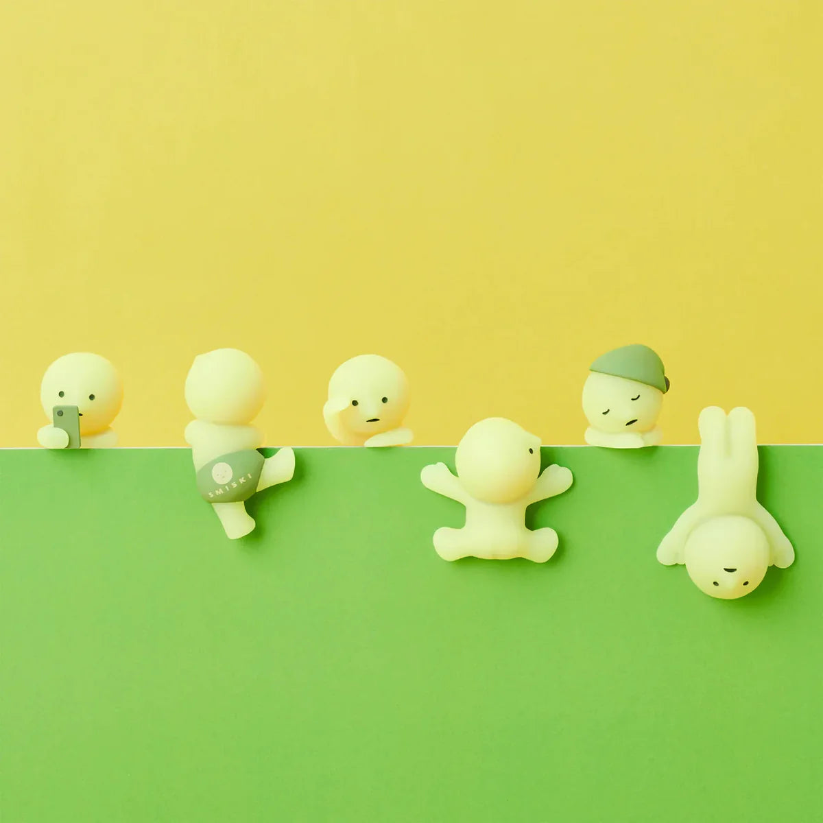 Smiski collectible figure, glow-in-the-dark mini character in quirky poses, perfect for shelves and desks.